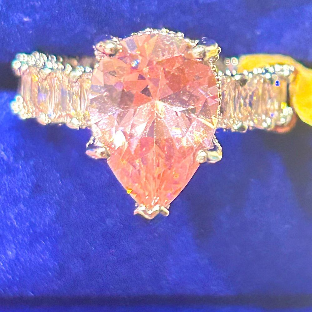 Pink Moissanite diamond pear cut ring. All pink diamonds on band 5karat size 7.